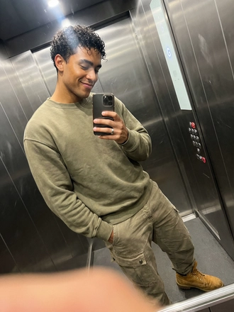 Photorealistic on-model full body photo — elevator influencer — created with ANZURES