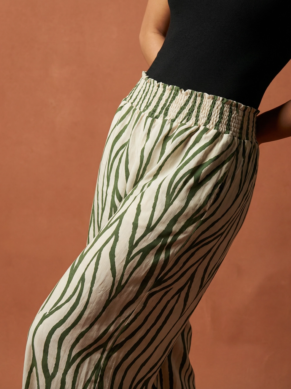 Photorealistic on-model close-up photo — studio editorial — created with ANZURES